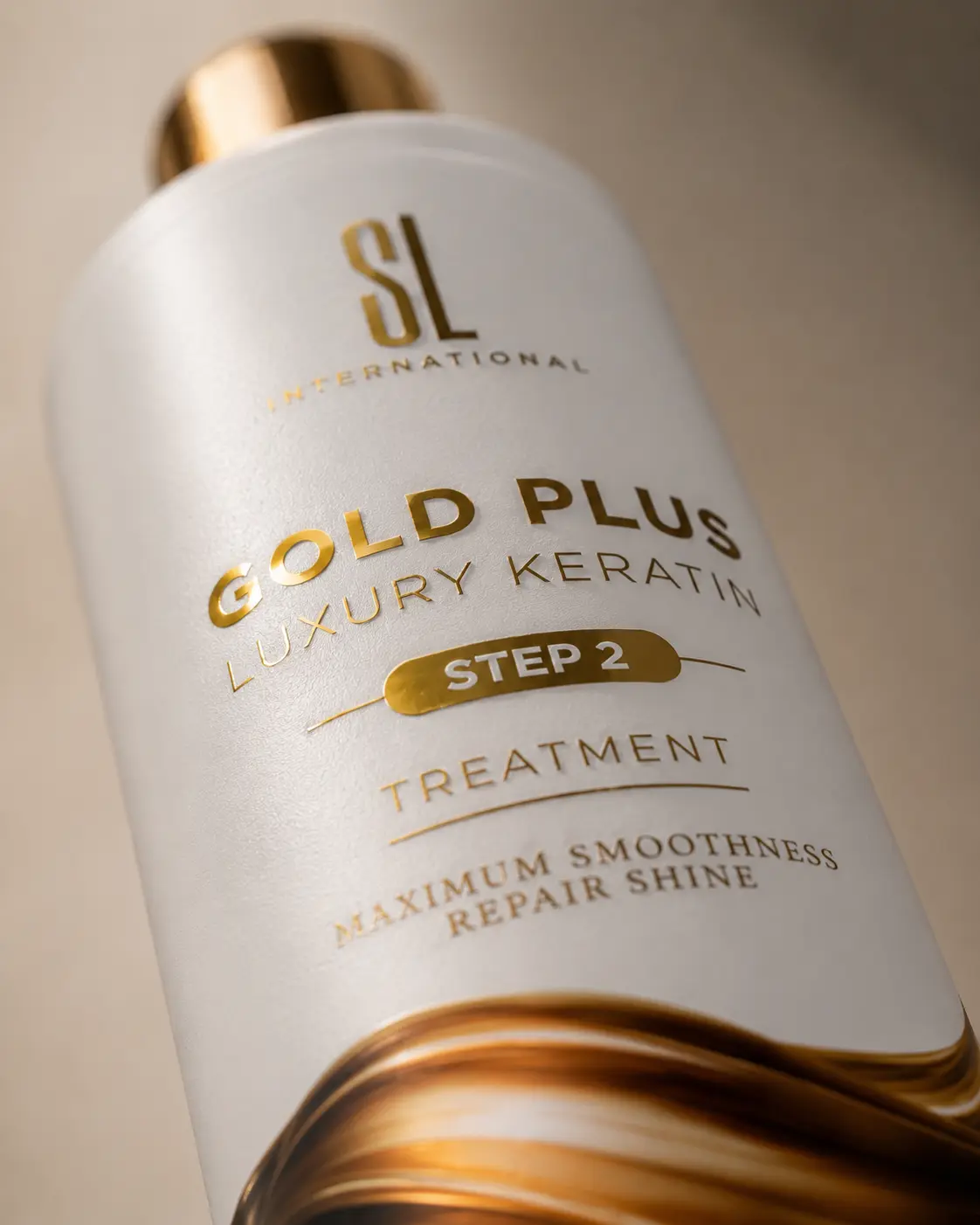 Macro close-up of SL International Gold Plus Luxury Keratin label showing gold foil texture and premium packaging detail